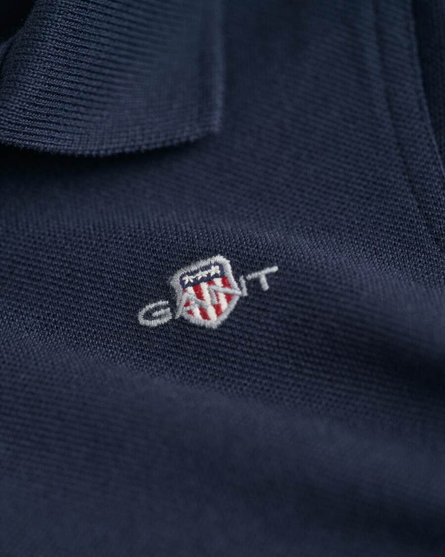 kinder-poloshirt aus piqué mit schildmuster – abendblau