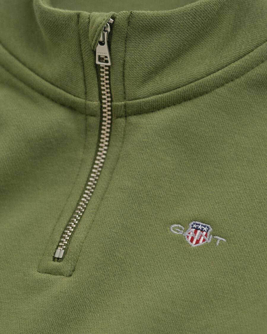 kinder-sweatshirt mit halbem reißverschluss und schildmotiv – olivgrün