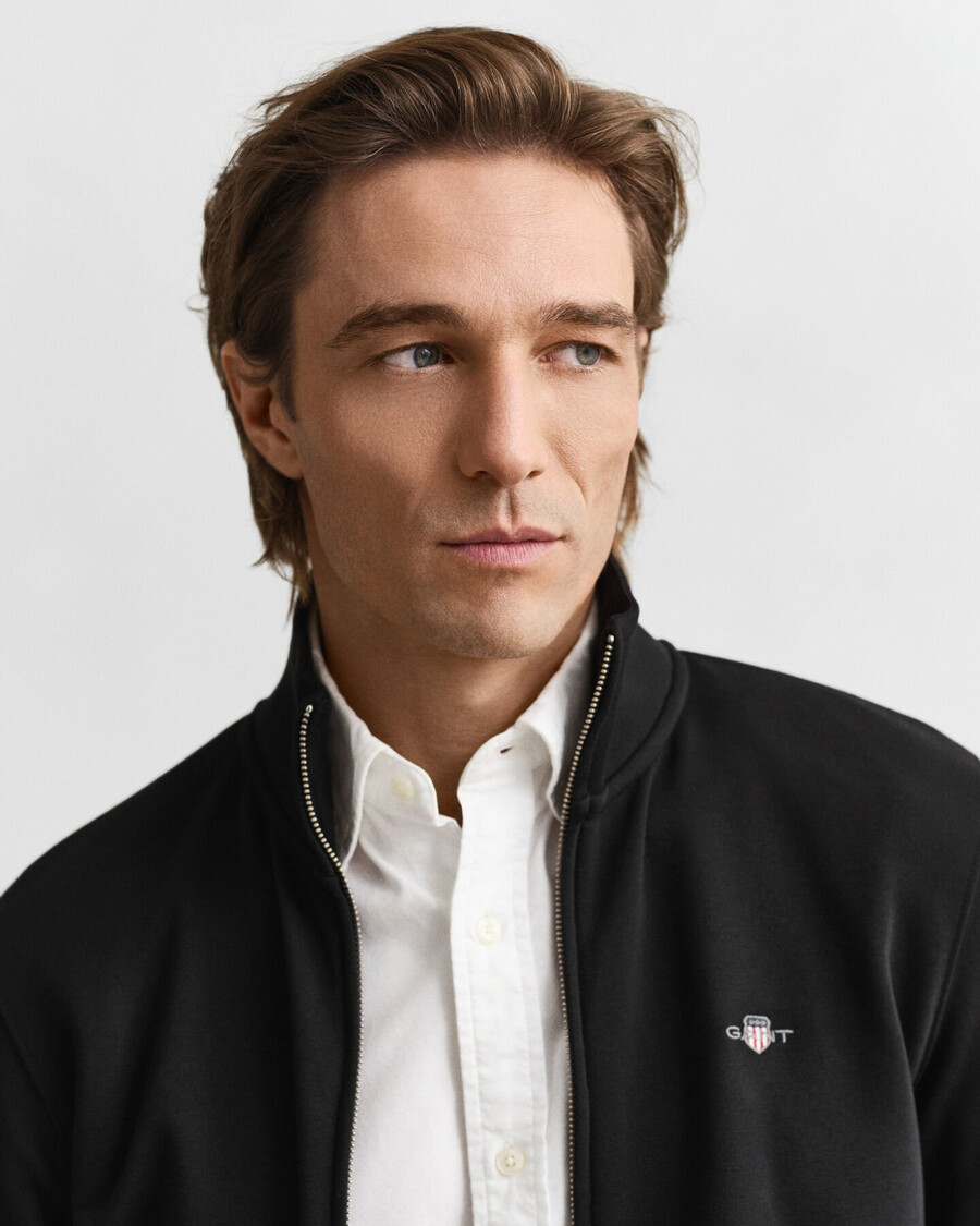 sweatshirt mit reißverschluss und schildmotiv – schwarz