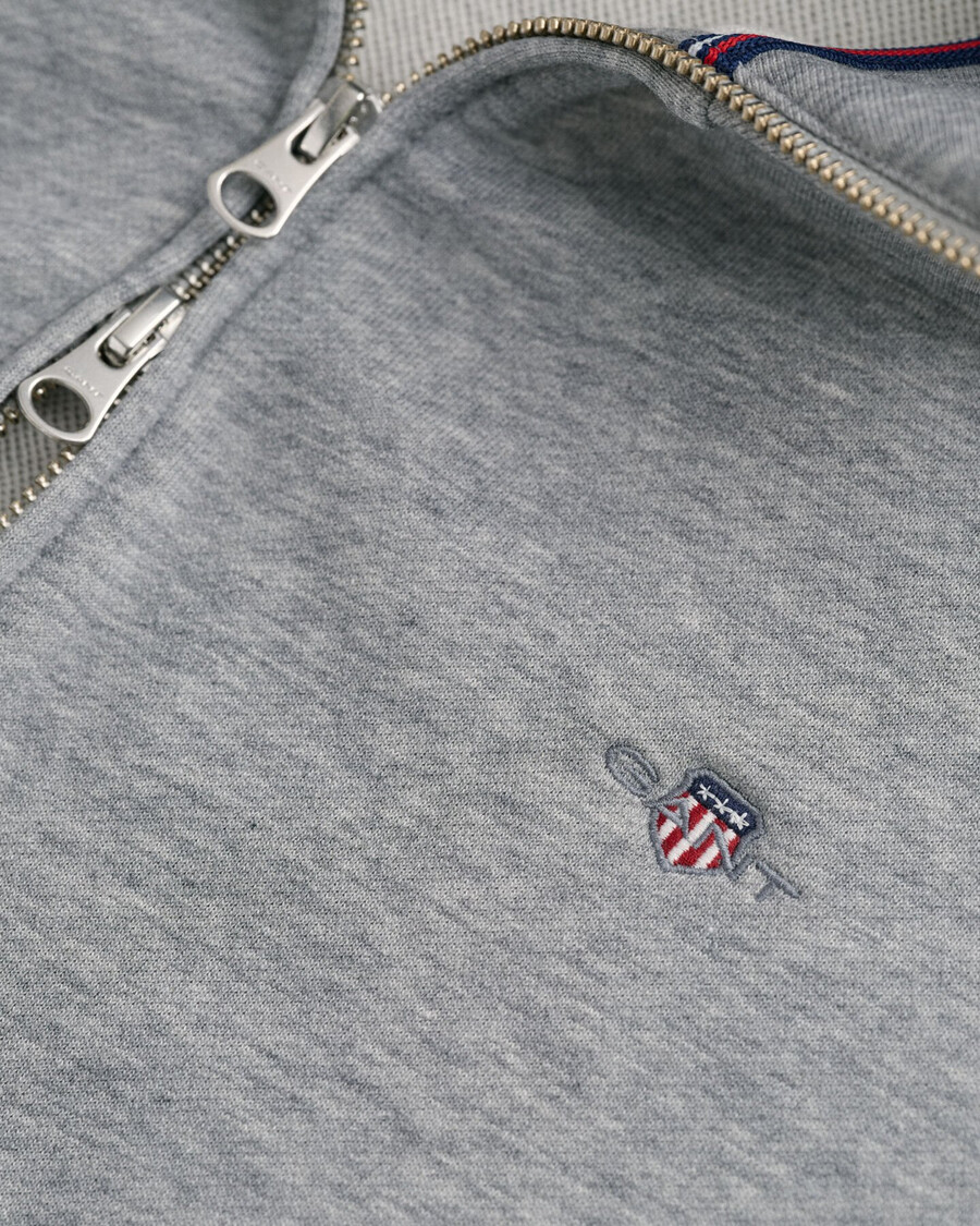 sweatshirt mit reißverschluss und schildmuster – graumeliert