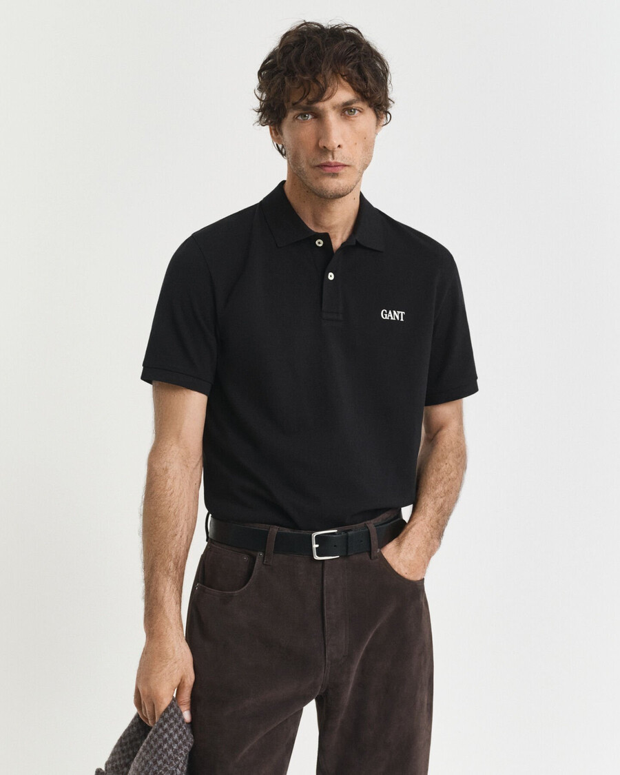 poloshirt mit kleinem grafikprint – schwarz