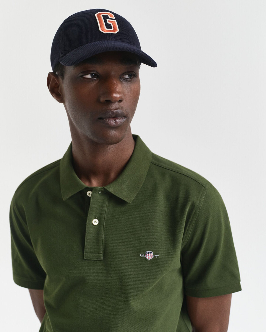 poloshirt aus piqué-leder mit regulärer passform – country green