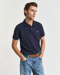 schmal geschnittenes poloshirt aus piqué mit schildmuster – abendblau