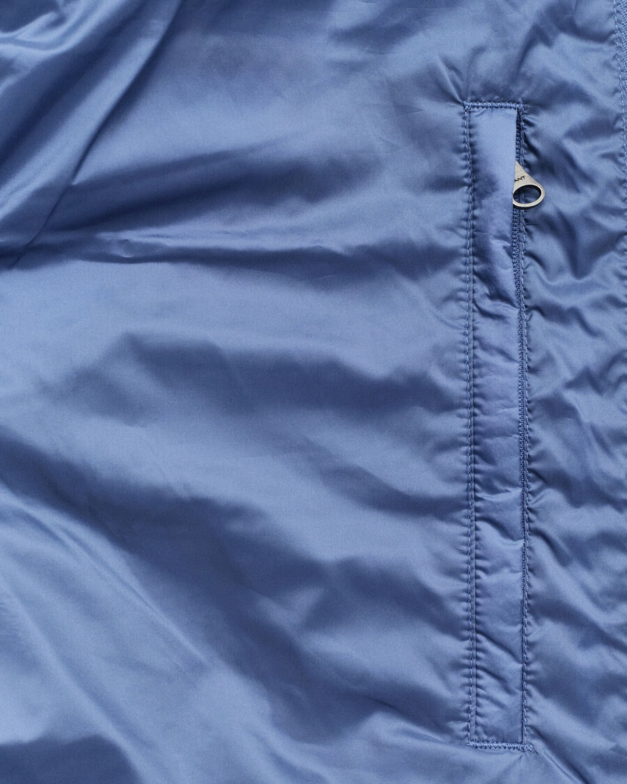 leichte daunenweste – vintage-blau