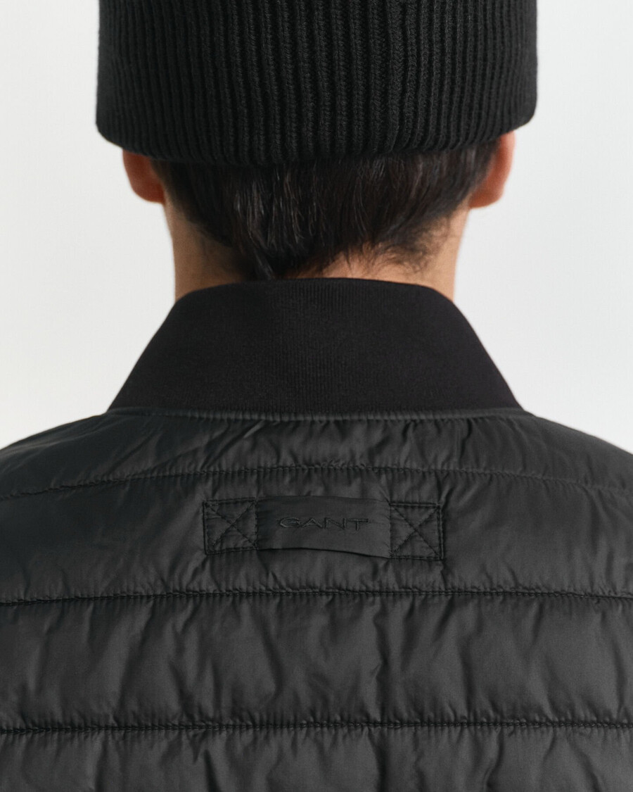doppelte mittellange jacke - schwarz