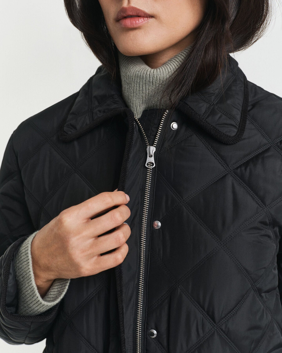gesteppte jacke mit cordbesatz – schwarz