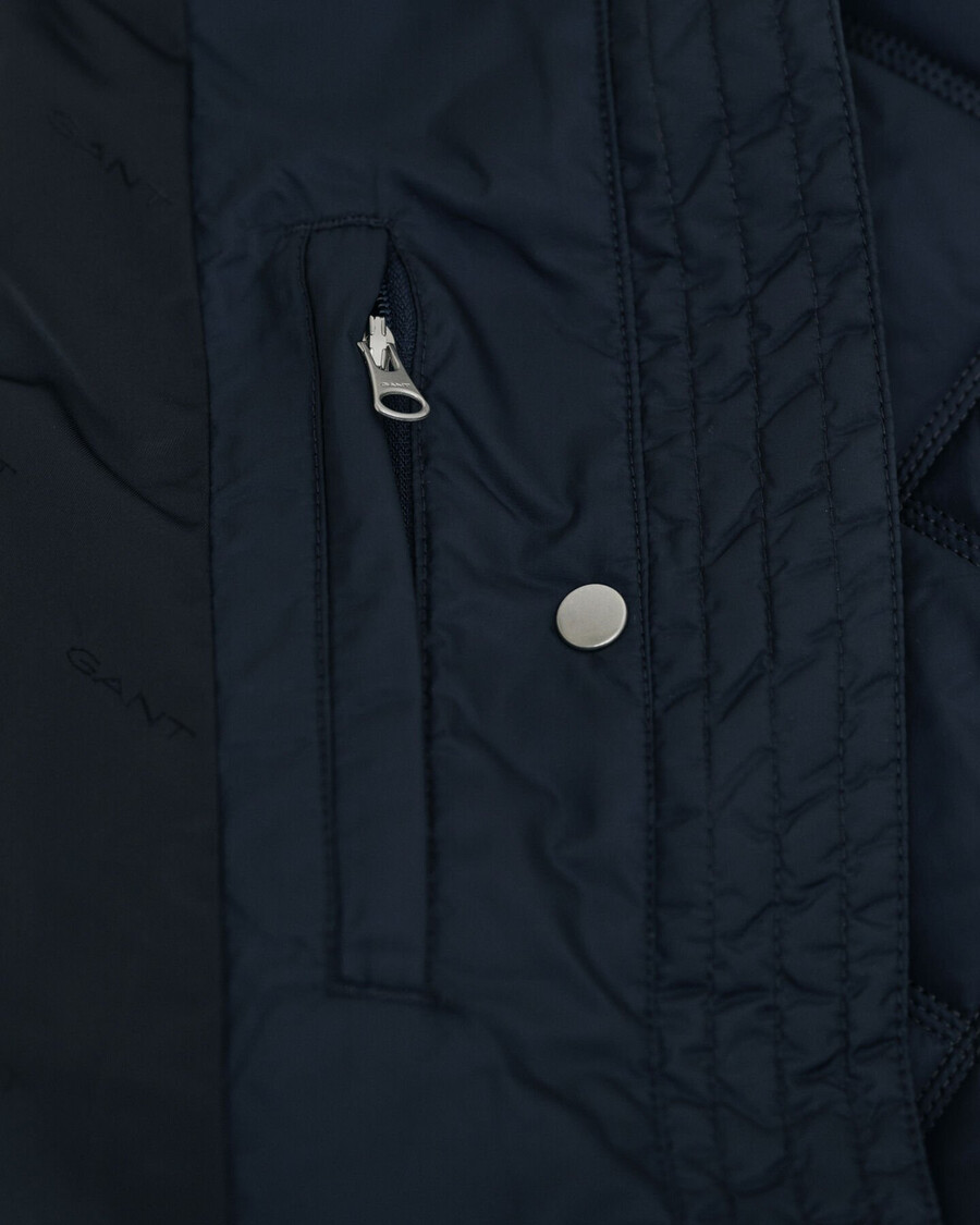 gesteppter cordmantel mit besatz – abendblau