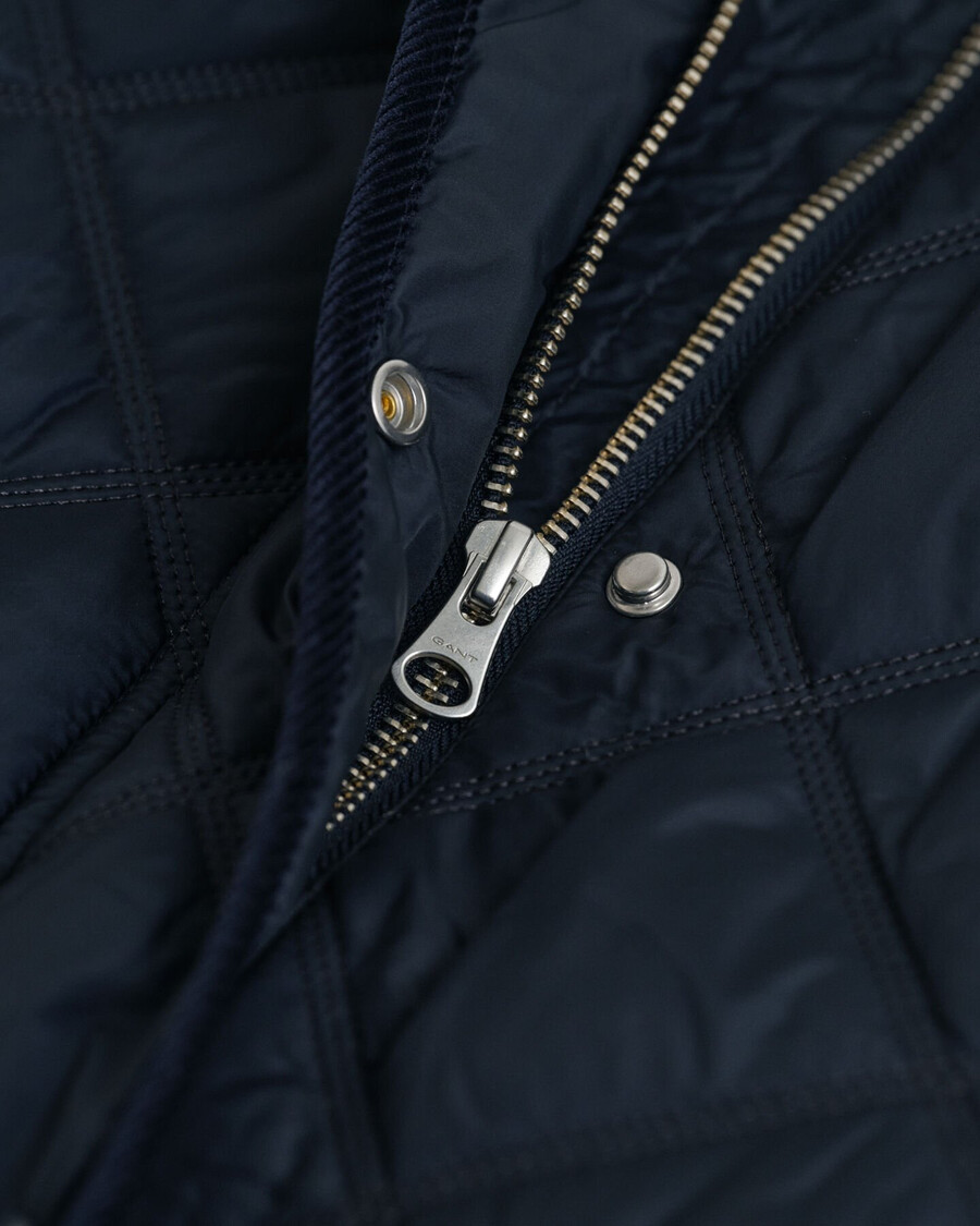 gesteppter cordmantel mit besatz – abendblau