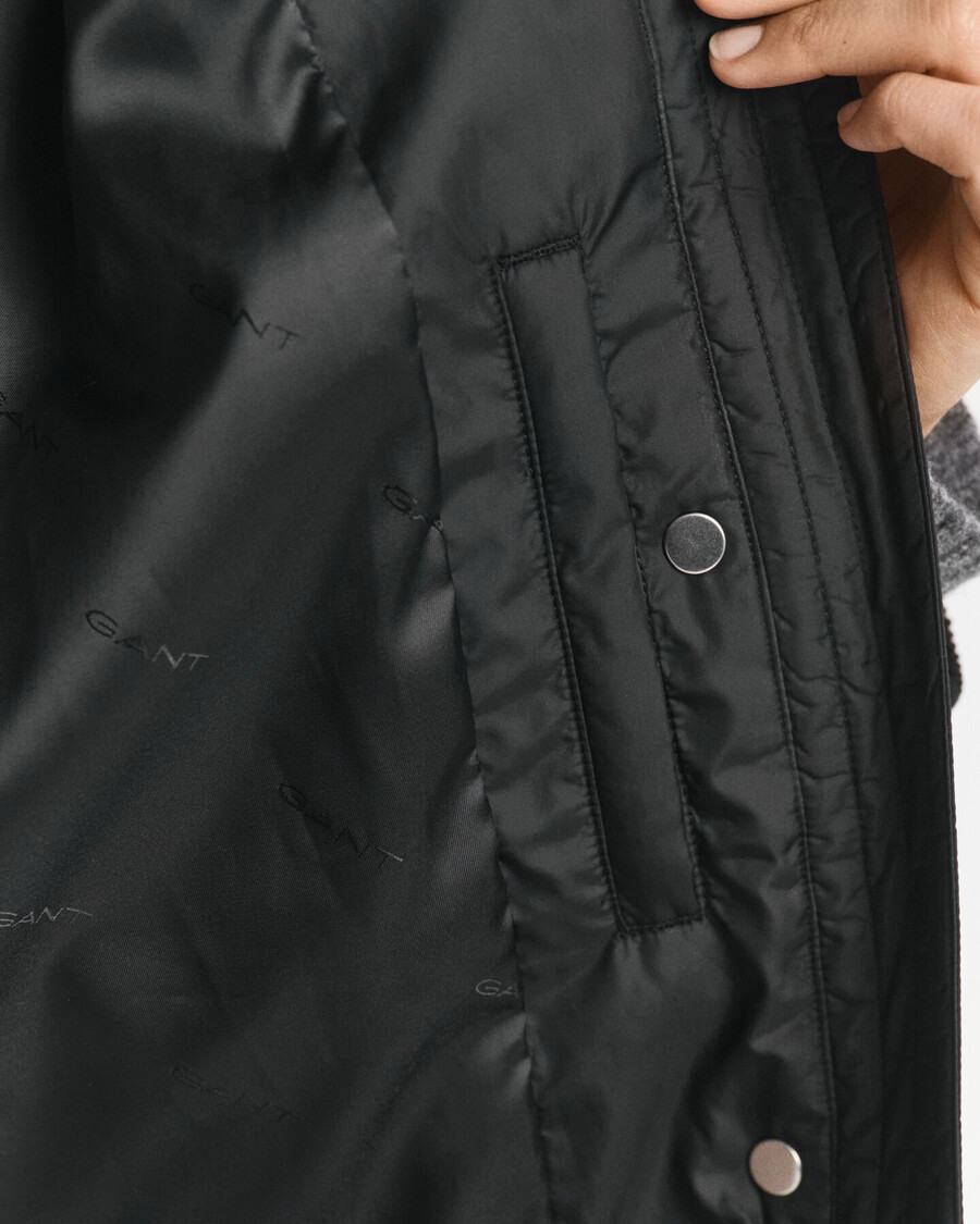 gesteppter cordmantel mit besatz – schwarz