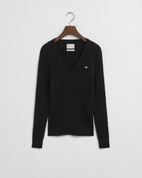 schwarzer baumwollpullover mit zopfmuster und v-ausschnitt